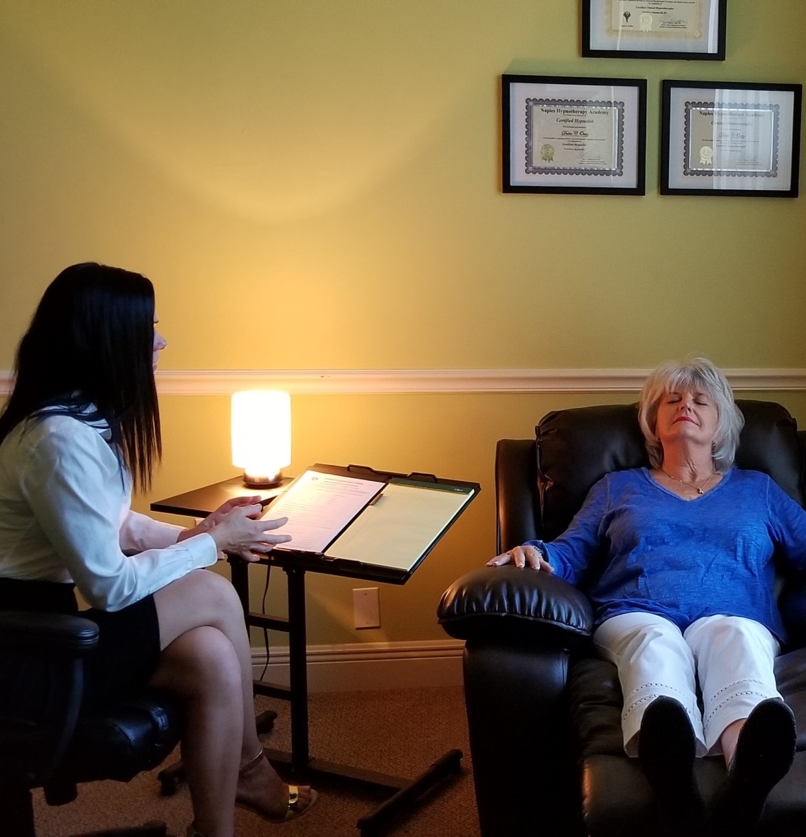 Woman being treated for depression by a certified hypnotherapist