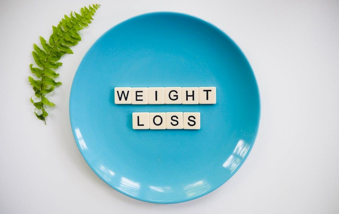 scrabble pieces spelling weight loss